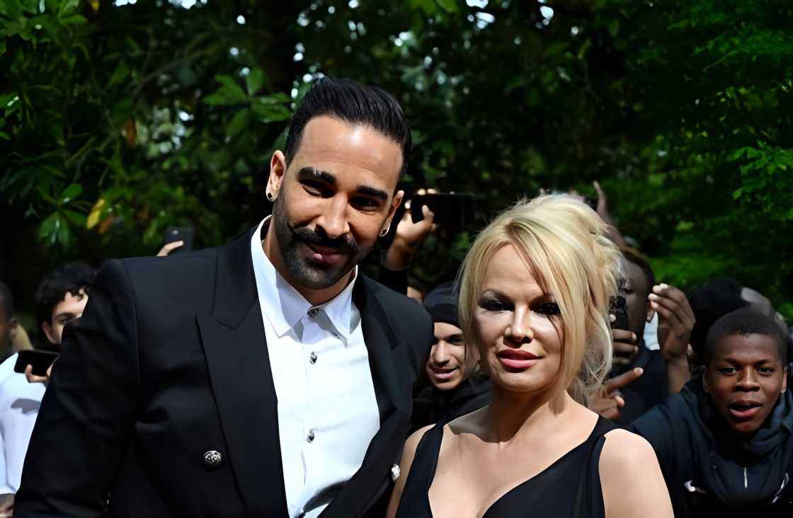 Adil Rami and Pamela Anderson at an event Adil Rami and Pamela Anderson at an event