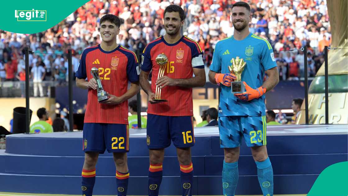 Spain's Pau Cubarsi, Rodri and Unai Simon pose on the podium during the award ceremony. Photo by AFP
