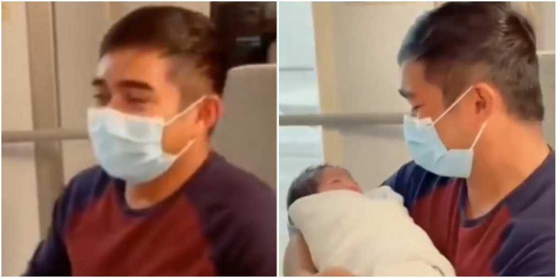 The father was emotional as he carried his baby for the first time The father was emotional as he carried his baby for the first time