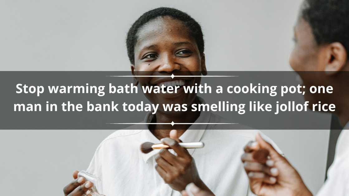 A happy woman in a white shirt holding a makeup brush