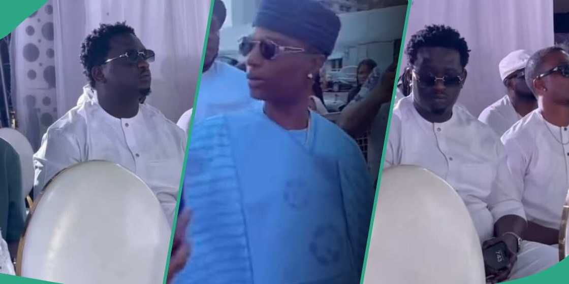 Wizkid and Wande Coal at his mother's burial. Wizkid and Wande Coal at his mother's burial.