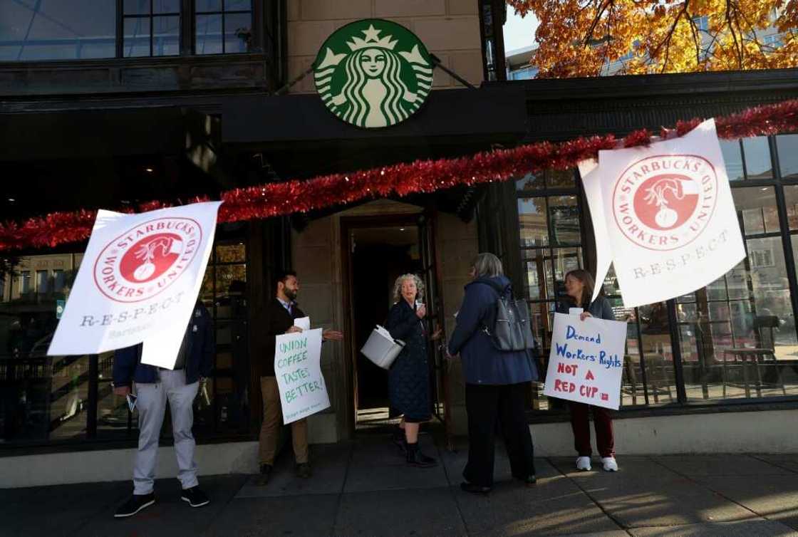 Members and supporters of Starbucks Workers United protest outside of a Starbucks store in Dupont Circle on November 16, 2023 in Washington, DC