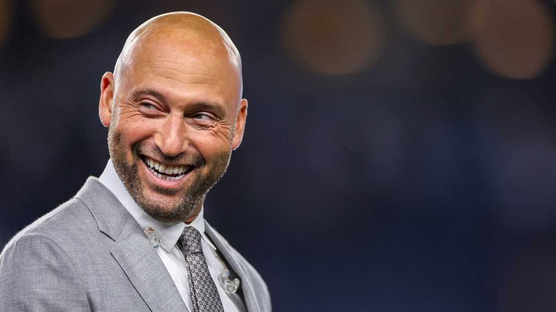 Former New York Yankee Derek Jeter laughs after a baseball game. Former New York Yankee Derek Jeter laughs after a baseball game.