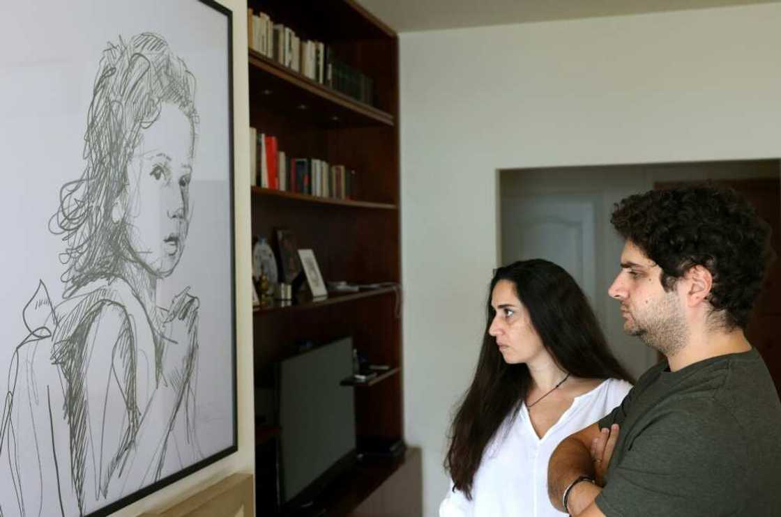 Paul and Tracy Naggear lost their three-year-old daughter Alexandra in the port blast: here they look at a drawing of her Paul and Tracy Naggear lost their three-year-old daughter Alexandra in the port blast: here they look at a drawing of her