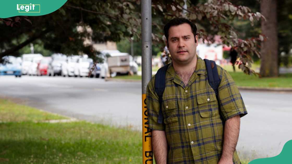 Michael Theo on the side of a quiet street