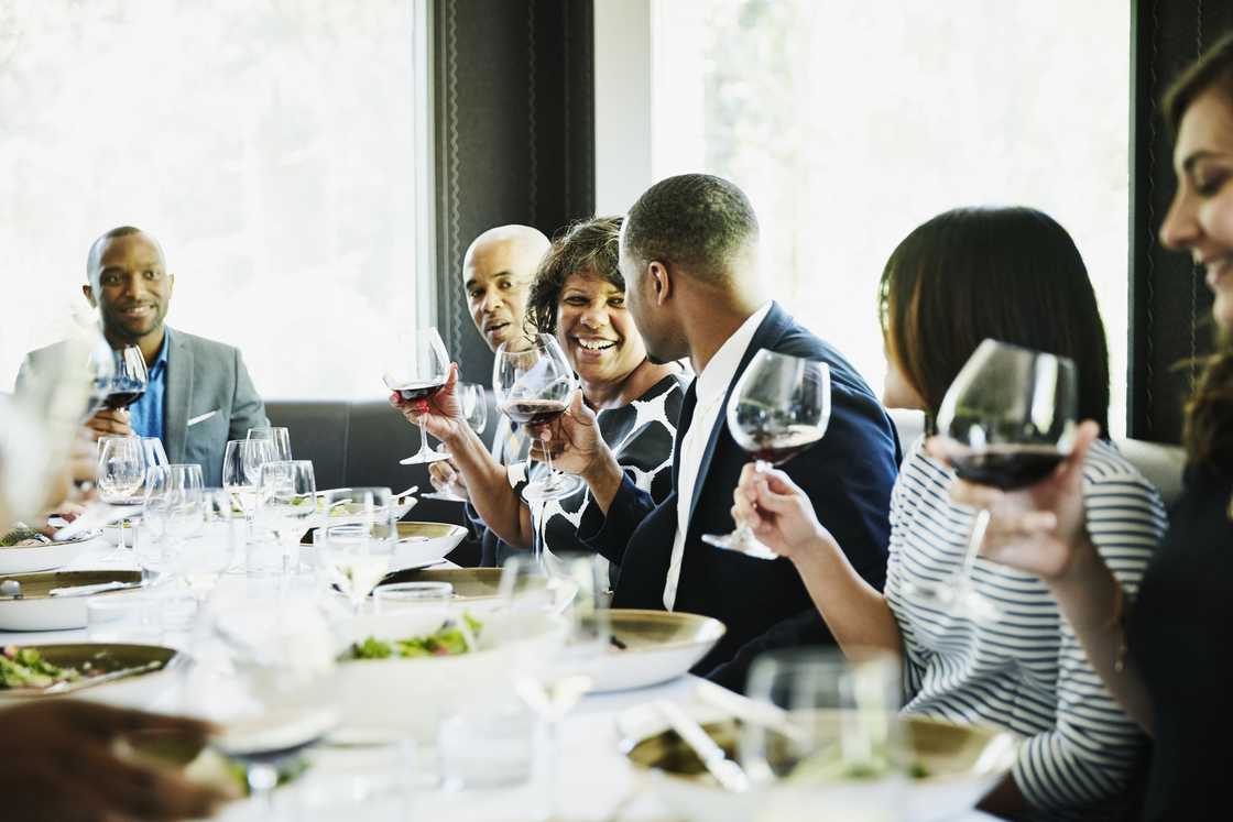 A group of people holding a party in a restaurant