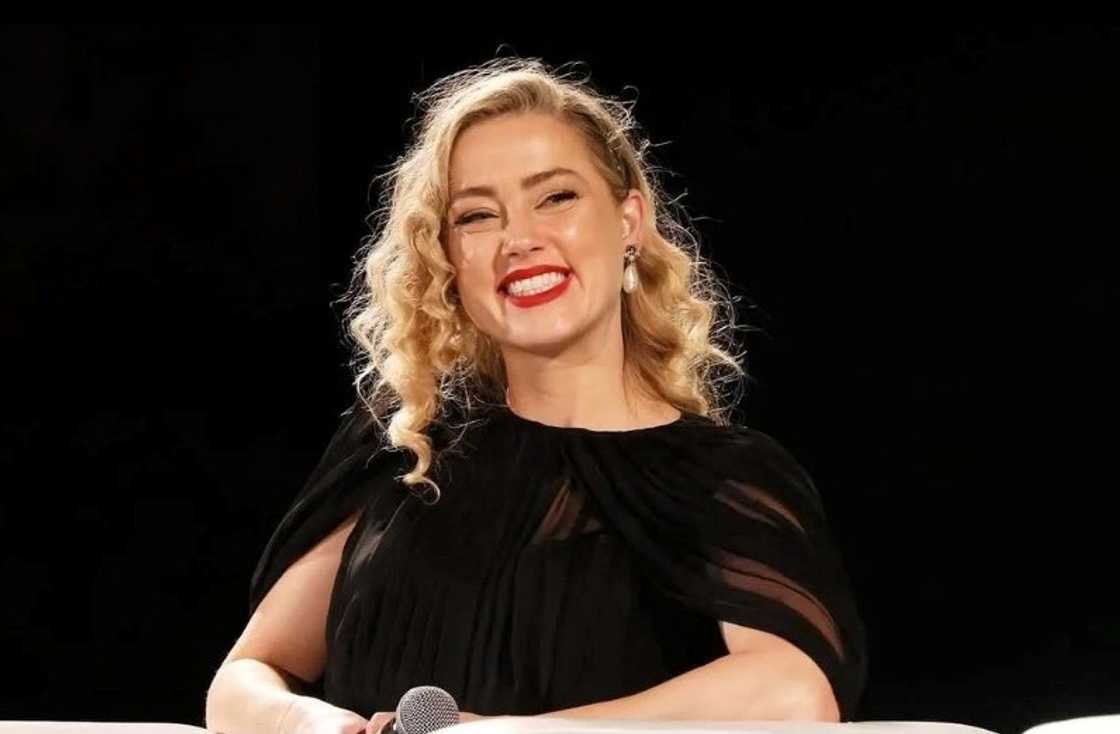 Amber Heard smiles during a press conference at the Taormina Film festival Amber Heard smiles during a press conference at the Taormina Film festival