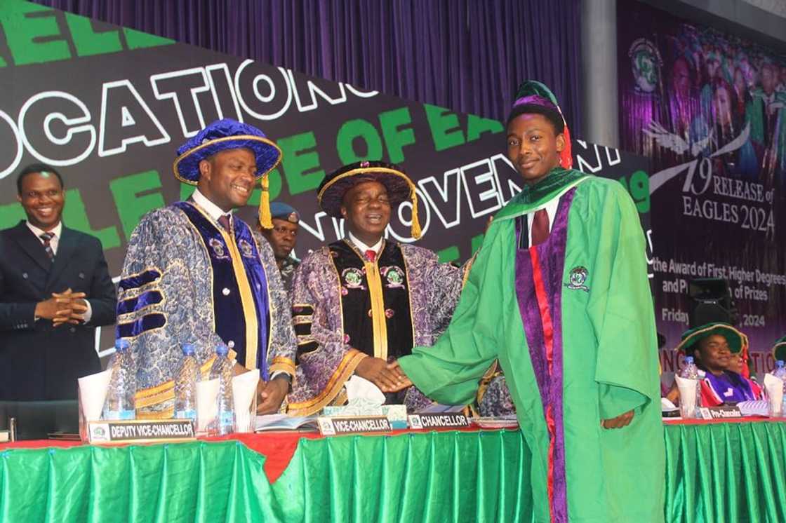 A Covenant University graduate shakes the Chancellor's hand on his graduation day A Covenant University graduate shakes the Chancellor's hand on his graduation day