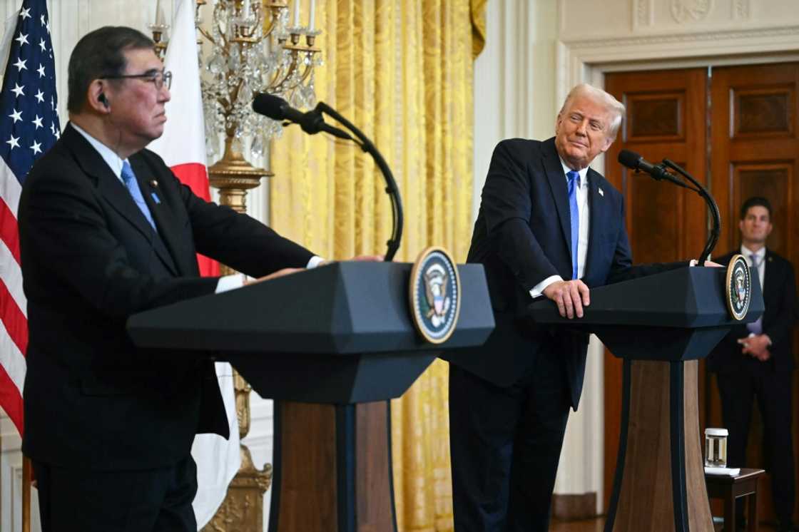 US President Donald Trump (R) looks on as Japanese Prime Minister Shigeru Ishiba speaks during a joint press conference in the East Room of the White House in Washington, DC, on February 7, 2025.