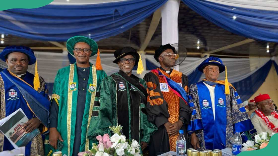 Tansian University dons pose for a photo