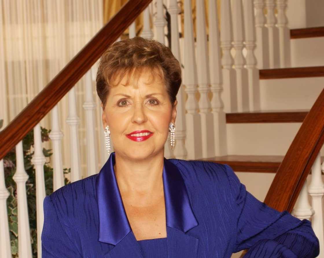 Joyce Meyer poses for a portrait in a blue outfit infront of the stairs Joyce Meyer poses for a portrait in a blue outfit infront of the stairs