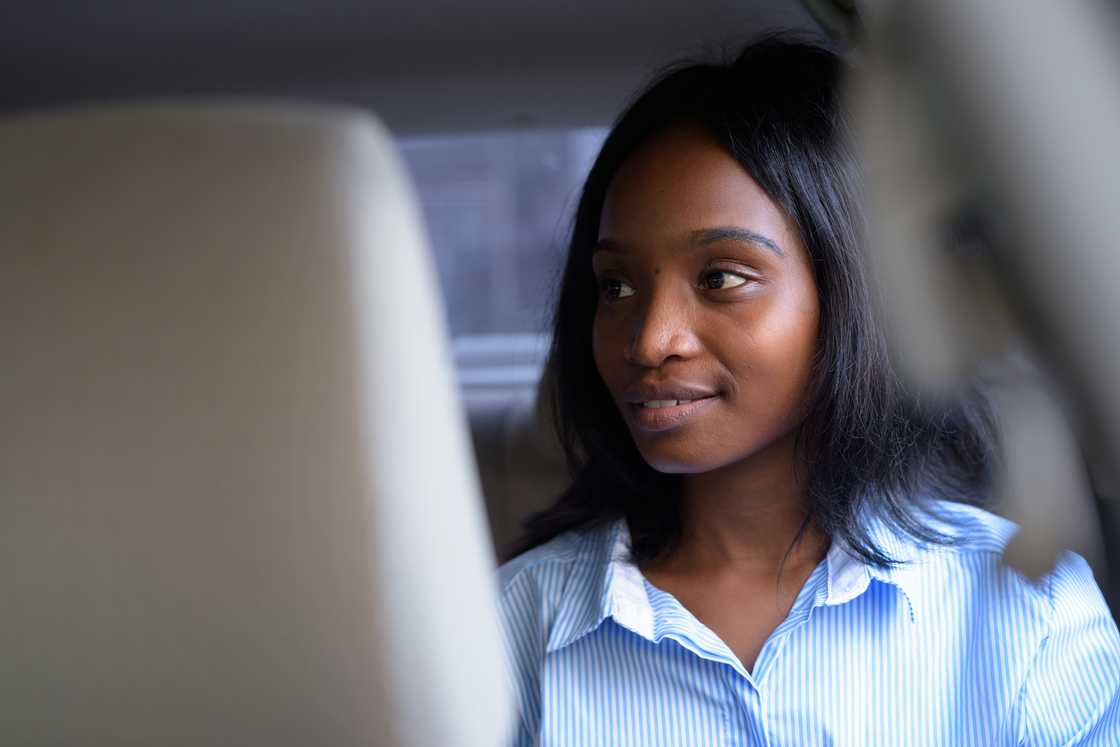 A lady in the back seat A lady in the back seat