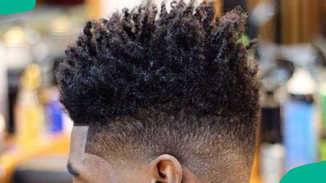 Curly fauxhawk with temple fade design for men Curly fauxhawk with temple fade design for men