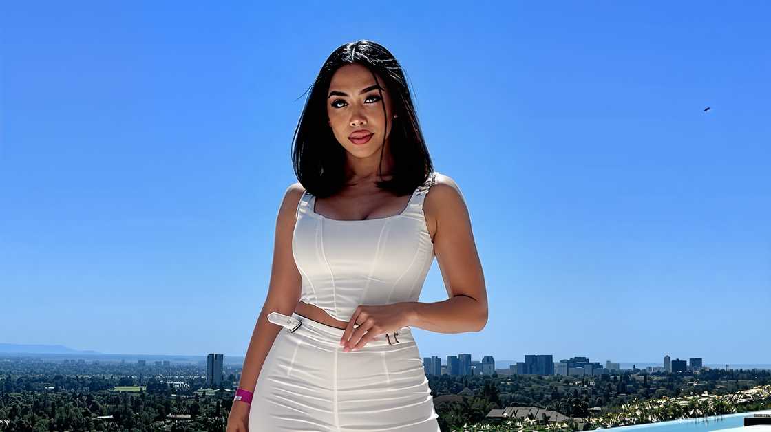 Morelia De La Hoya, Oscar De La Hoya's youngest half-sister, poses in a white outfit.