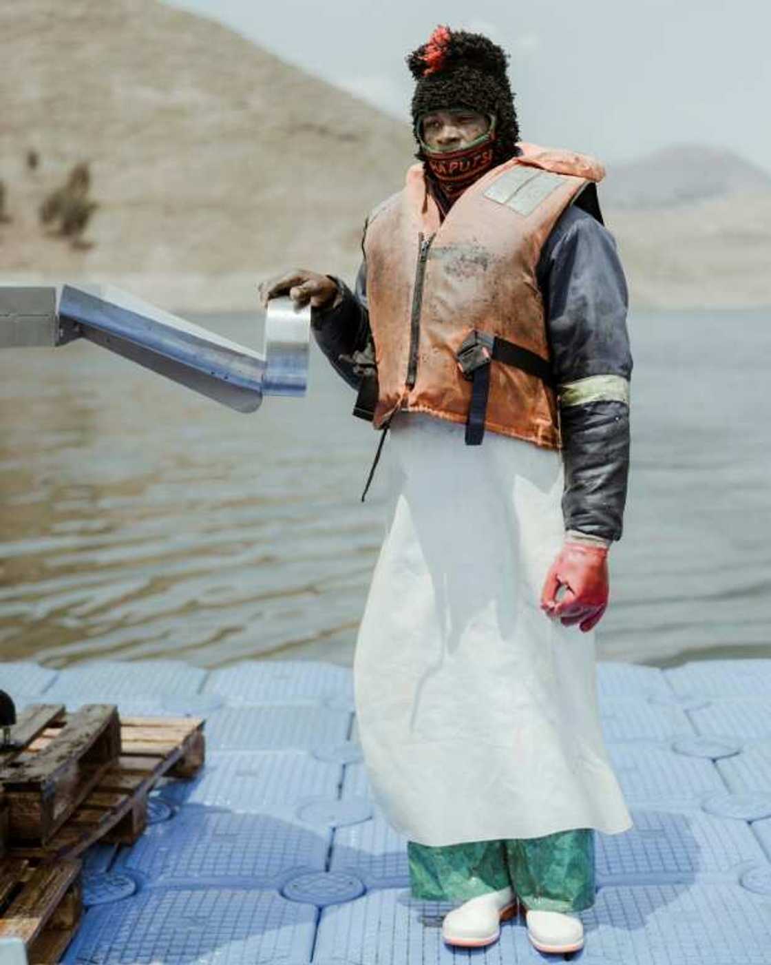 Dlodlo, a 26-year-old fish-farm worker, at the end of a day's harvesting Dlodlo, a 26-year-old fish-farm worker, at the end of a day's harvesting