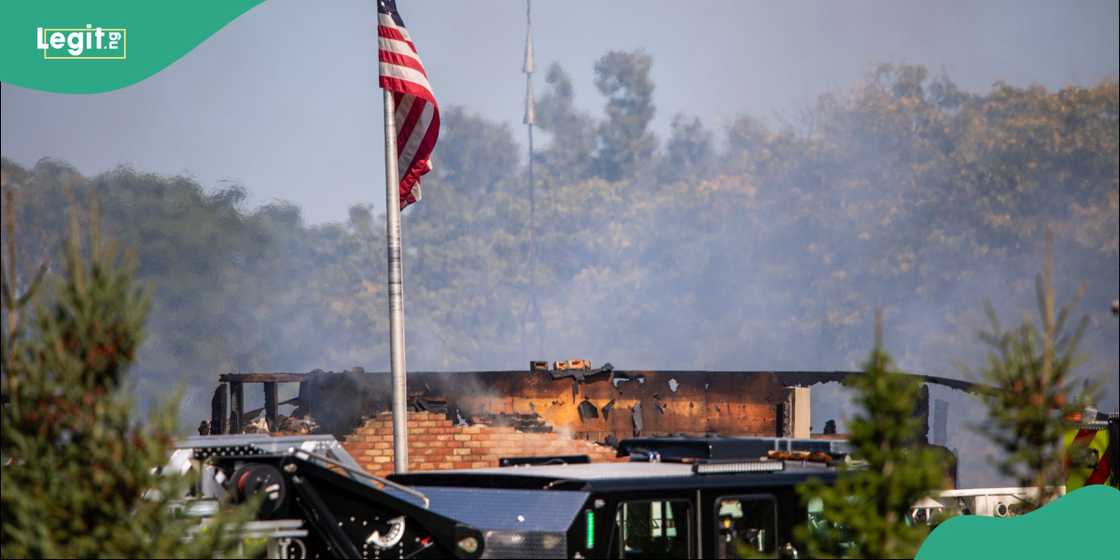 Firefighters work to extinguish flames inside the Michigan church after a gunman opened fire and set the building ablaze.