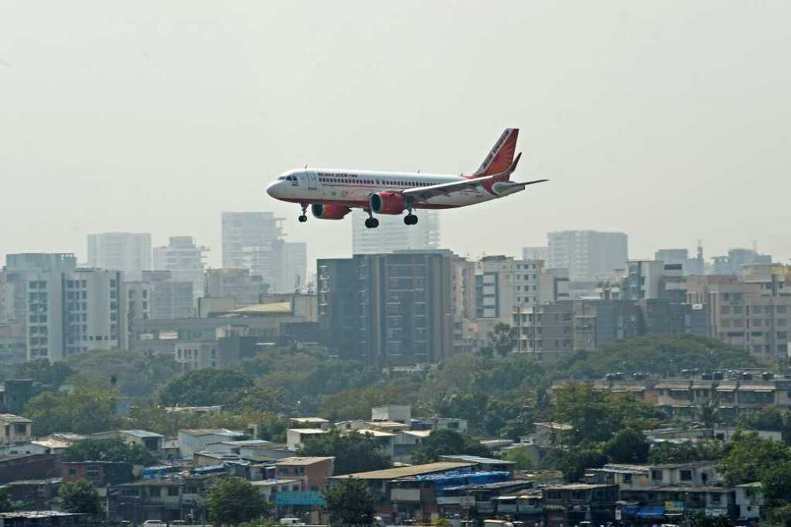 Wells Fargo on Friday sacked a top Indian executive now being pursued by police for allegedly urinating on a fellow passenger aboard an Air India flight Wells Fargo on Friday sacked a top Indian executive now being pursued by police for allegedly urinating on a fellow passenger aboard an Air India flight