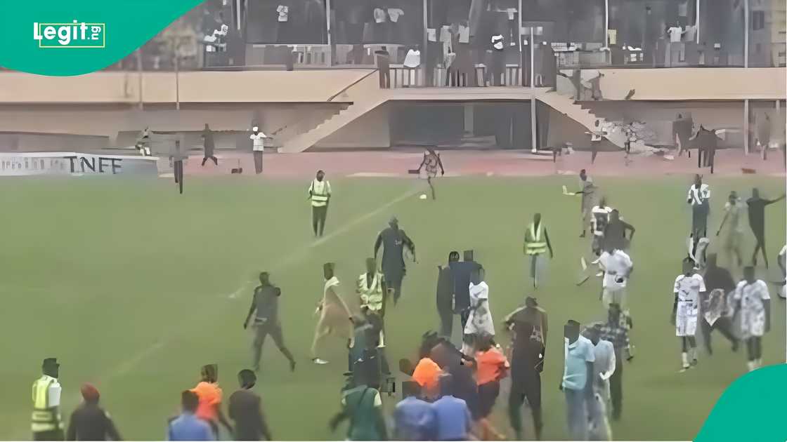Kwara United fans invade restricted areas after a late goal Kwara United fans invade restricted areas after a late goal