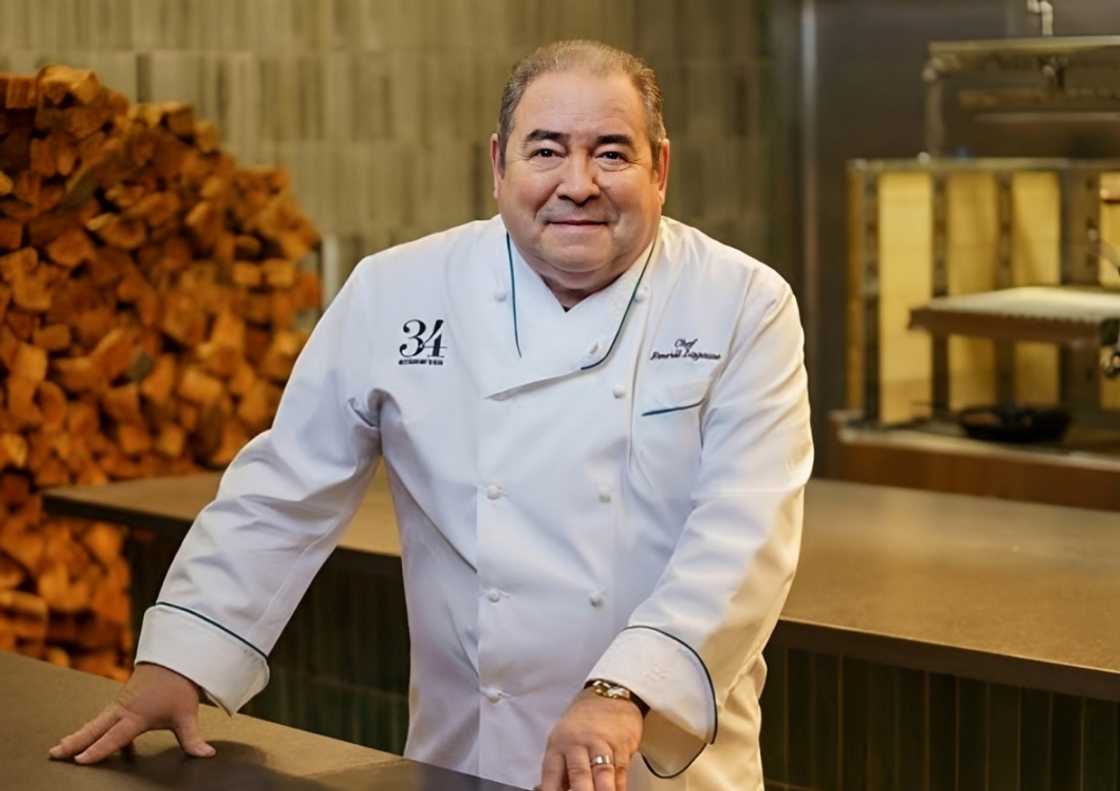 Emeril Lagasse poses in a kitchen setting