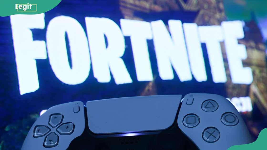 PlayStation DualSense controller and Fortnite on PlayStation Store displayed on a tv screen PlayStation DualSense controller and Fortnite on PlayStation Store displayed on a tv screen