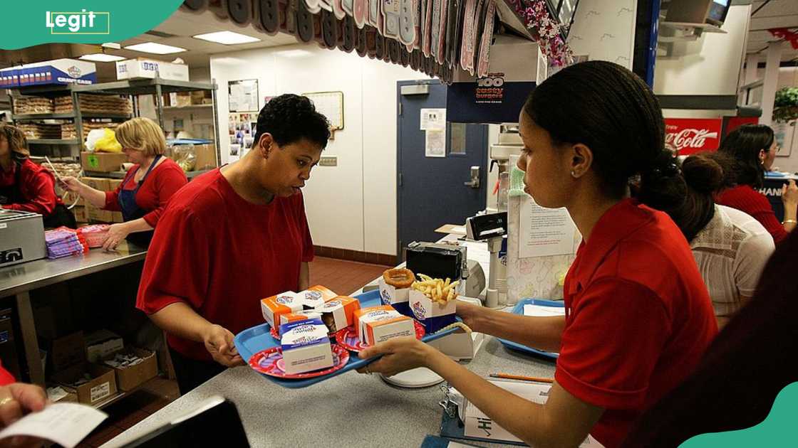 A waitress picks up a customer's order in a White Castle restaurant in Des Plaines, Illinois.