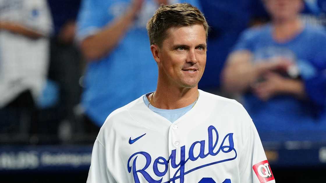 Former Kansas City Royals player Zack Greinke walks onto the diamond before throwing the first pitch prior to a match between the New York Yankees and the Kansas City Royals.