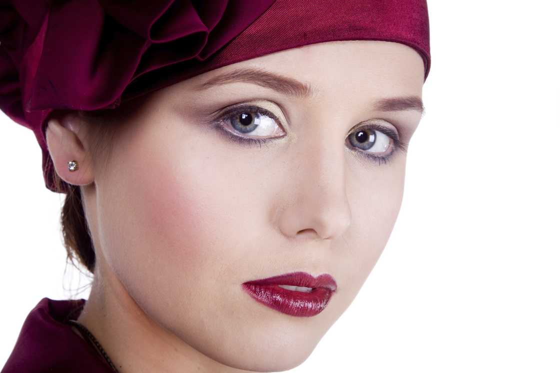 A beautiful woman in 1920s glamour, pale, matte complexion A beautiful woman in 1920s glamour, pale, matte complexion