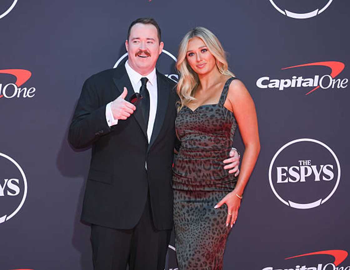 Shane Gillis and Grace Brassel posing for a photo.