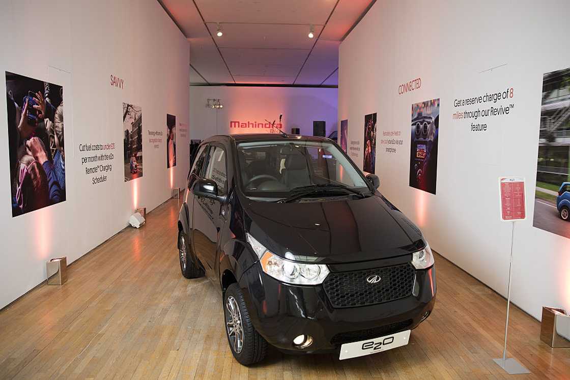 A black Mahindra e2o electric car on display A black Mahindra e2o electric car on display