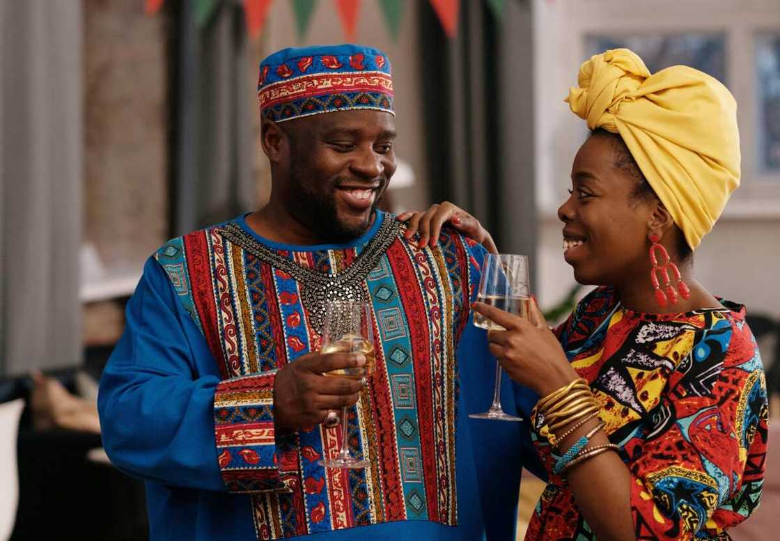 A man and woman drinking wine