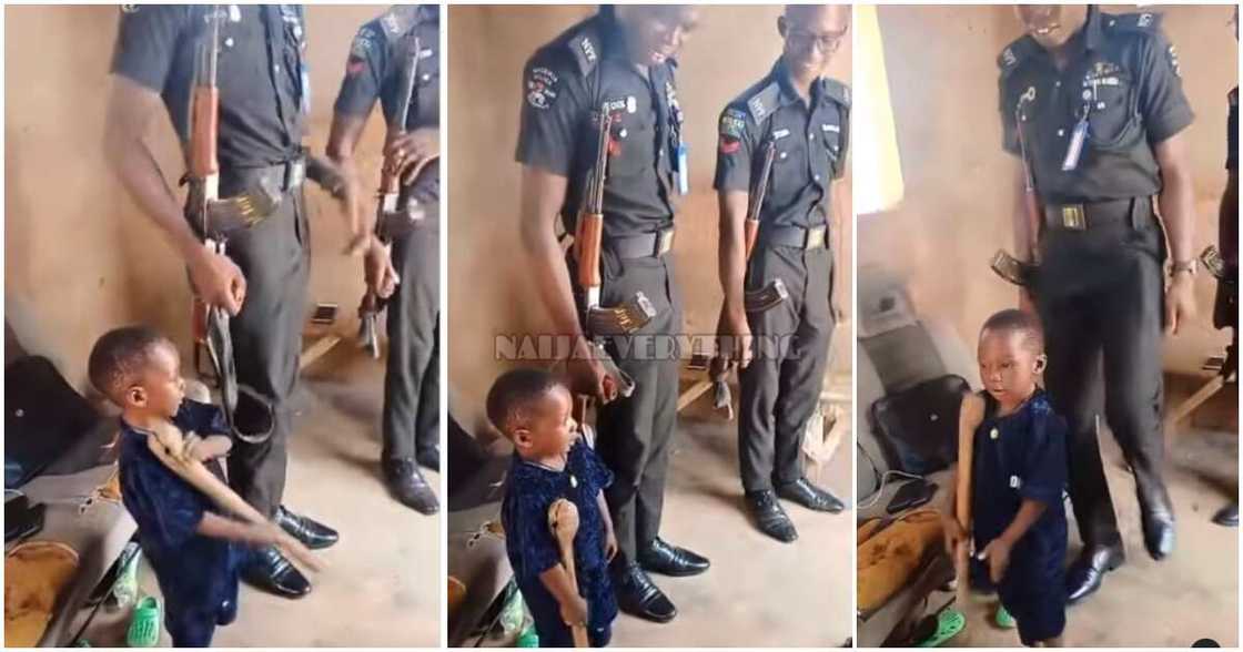 Bold little boy, policemen, guns, Nigerian policemen with guns Bold little boy, policemen, guns, Nigerian policemen with guns