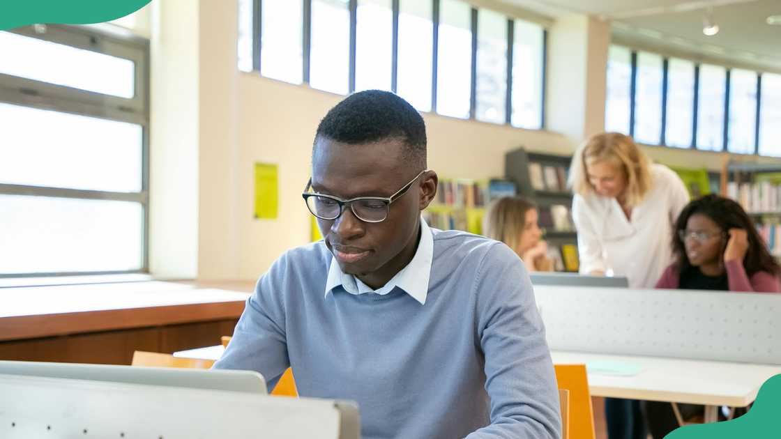 A student browses on his laptop during a lesson