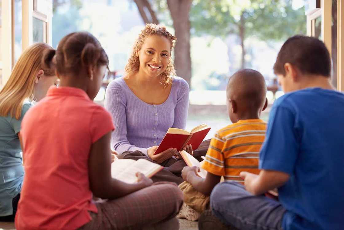 Young people reading the Bible