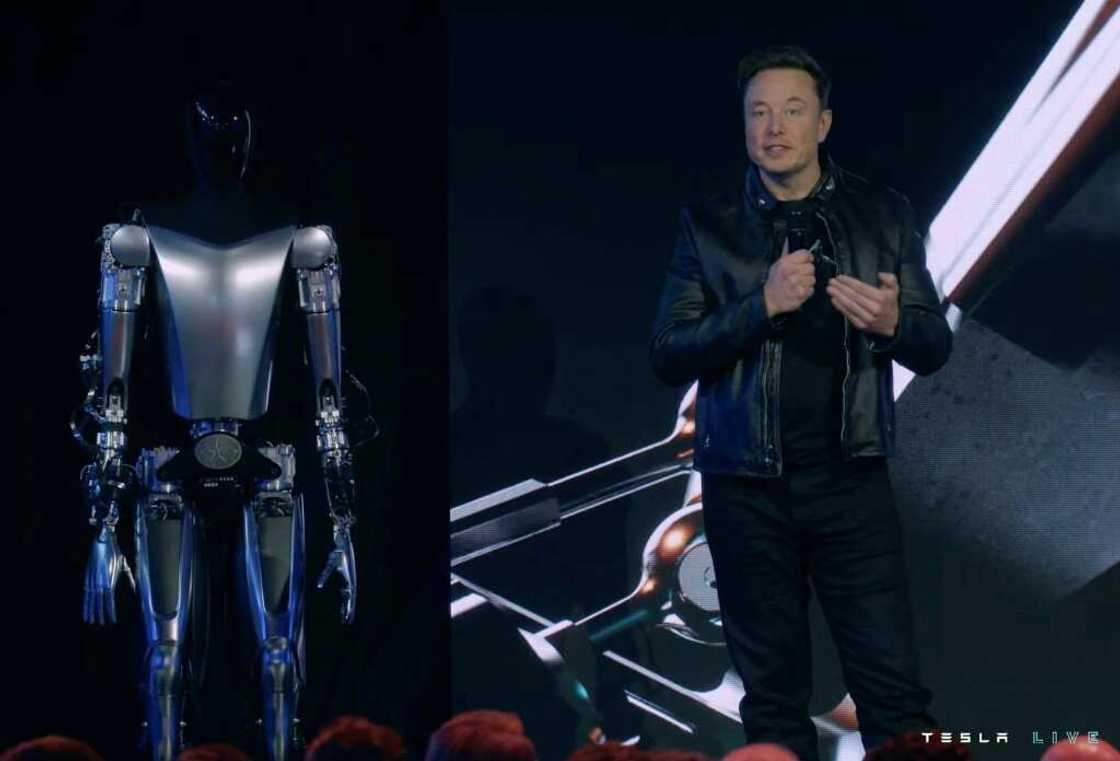 Elon Musk says an Optimus humanoid robot that Tesla is developing could be priced at less than $20,000 and wind up doing most of the work while people reap the benefits.