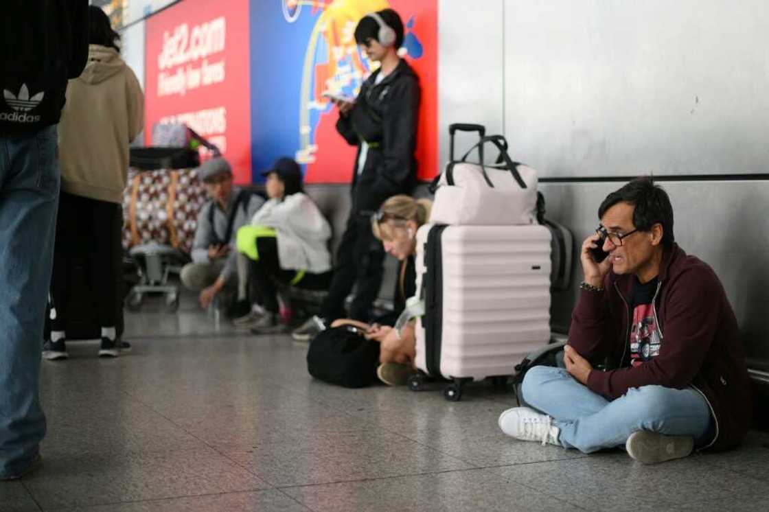 Passengers continued to be affected by cancelled flights owing to Monday's incident, but far more planes were able to fly Passengers continued to be affected by cancelled flights owing to Monday's incident, but far more planes were able to fly