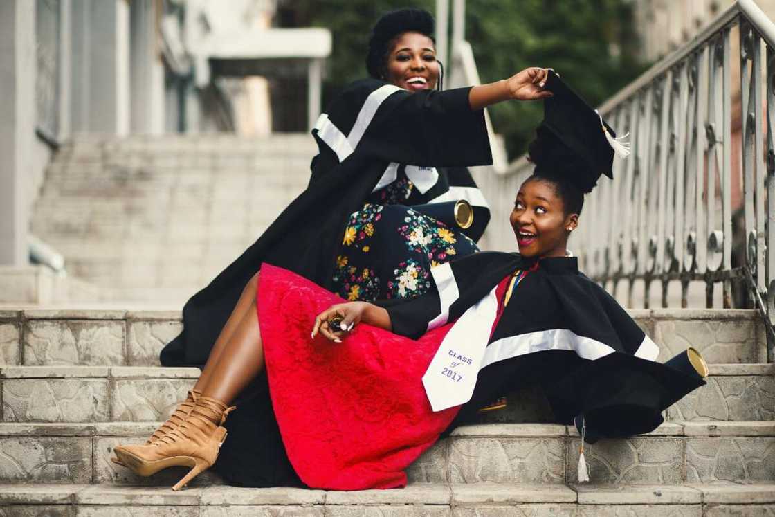 Students in academic dress on flight of stairs Students in academic dress on flight of stairs