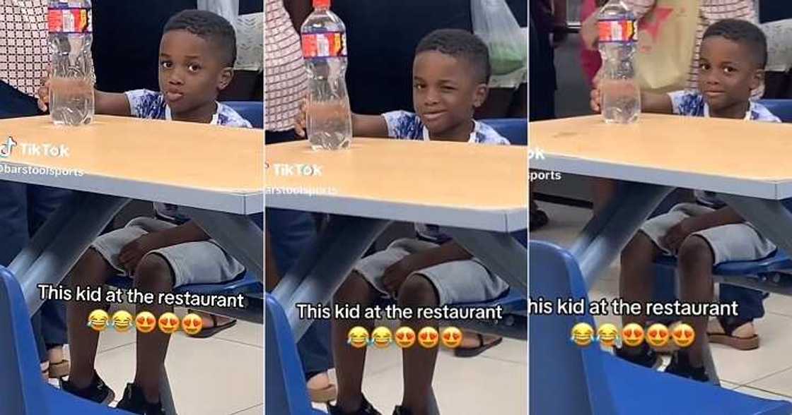 Little boy winks at lady in restaurant