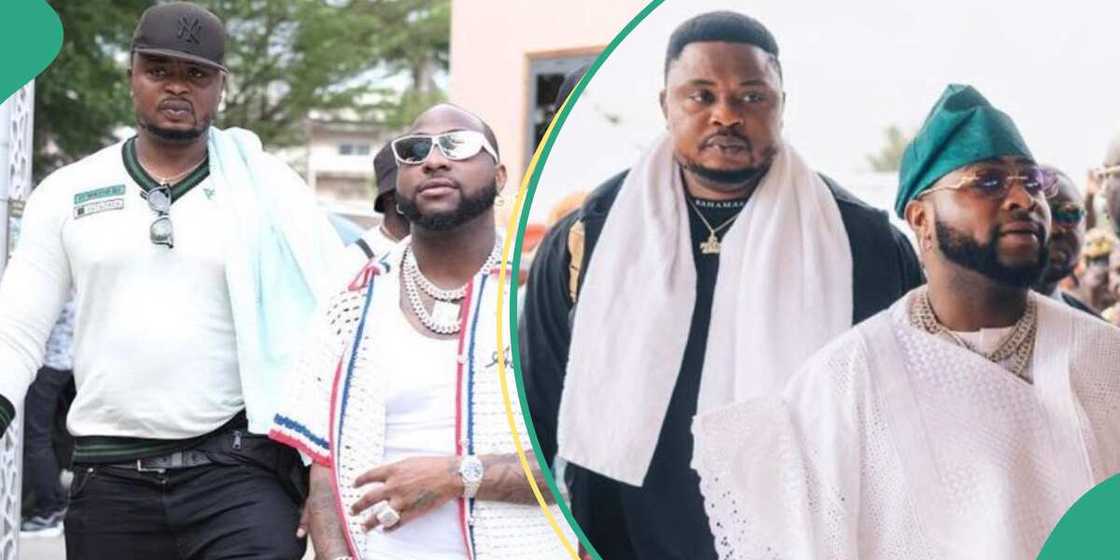 Davido gives his bouncer dollar notes. Davido gives his bouncer dollar notes.