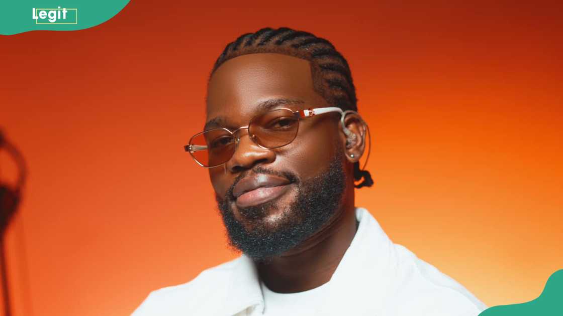 Broda Shaggi in a bright orange gradient background Broda Shaggi in a bright orange gradient background