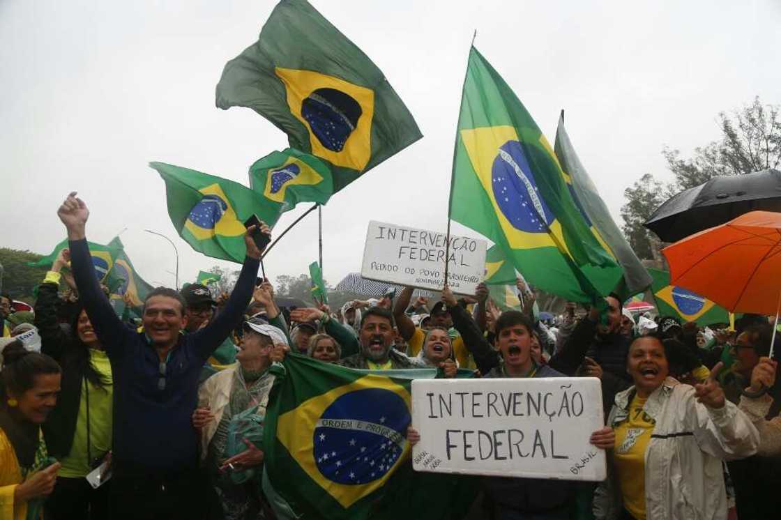 Supporters of President Jair Bolsonaro take part in a protest in the centre of Rio de Janeiro demanding the army helps prevent Luiz Inacio Lula da Silva taking power Supporters of President Jair Bolsonaro take part in a protest in the centre of Rio de Janeiro demanding the army helps prevent Luiz Inacio Lula da Silva taking power