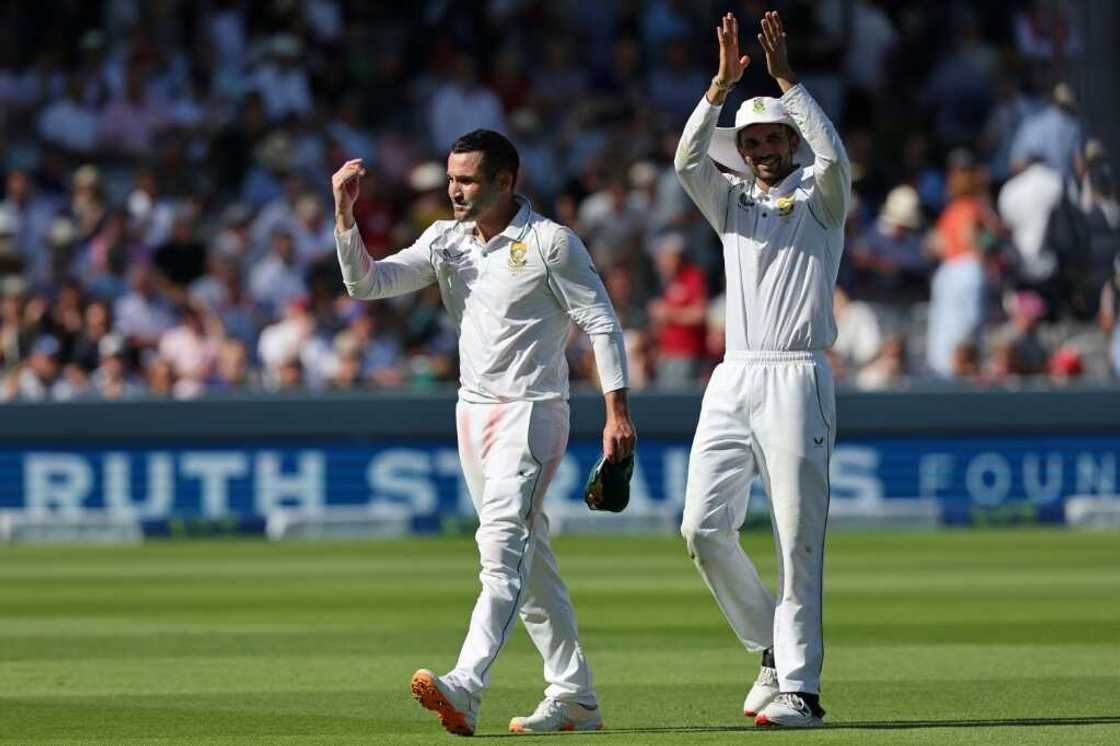 Winning feeling - South Africa captain Dean Elgar (L) and spinner Keshav Maharaj (R) celebrate after the Proteas' innings and 12-run win in the first Test at Lord's Winning feeling - South Africa captain Dean Elgar (L) and spinner Keshav Maharaj (R) celebrate after the Proteas' innings and 12-run win in the first Test at Lord's