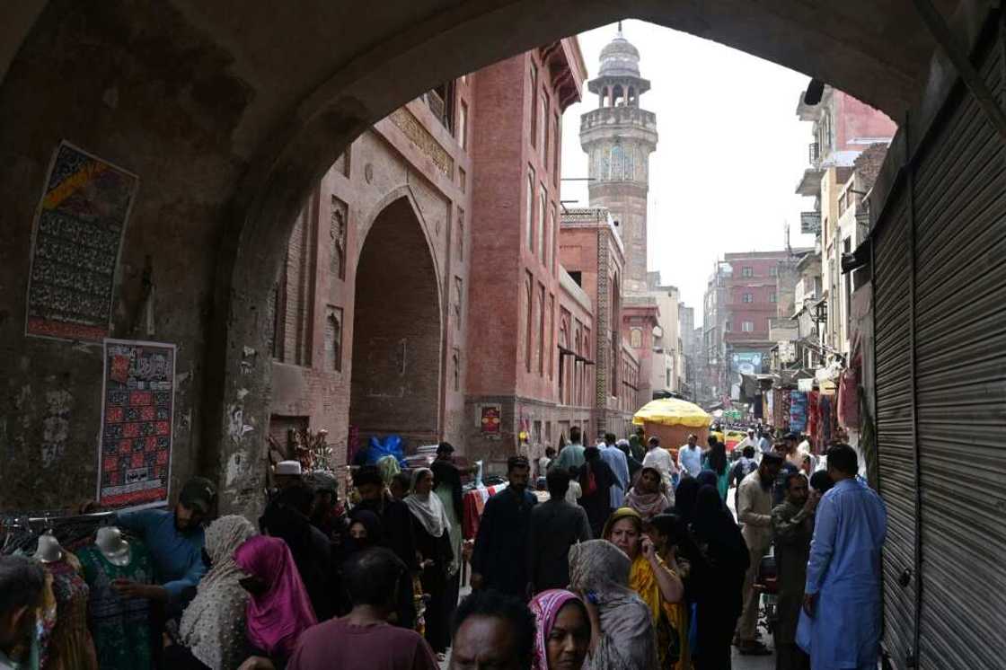 Instead of buying off-the-rack clothes for the girls, Fatima went shopping for fabric in the Old Lahore district and plans to home-stitch their holiday outfits