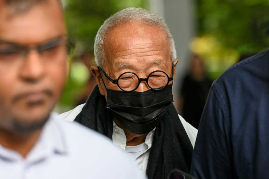 Malaysian hotel tycoon Ong Beng Seng (C) leaves the State Court in Singapore, in a rare corruption case in the city-state