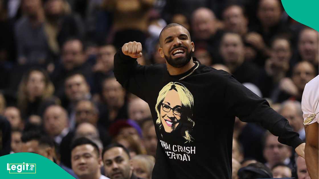 Drake celebrates as the Toronto Raptors lose to the Golden State Warriors on November 16, 2016. Photo by Steve Russell