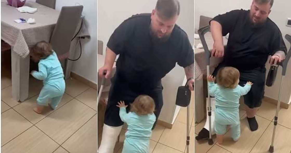 Little girl helps injured father, sit on chair