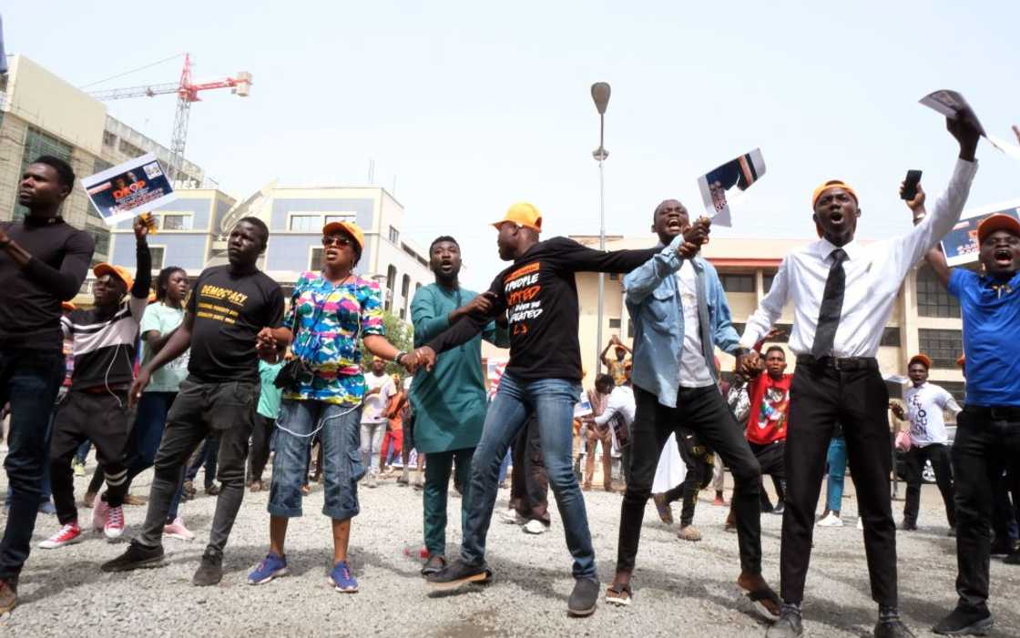 Supporters of Omoyele Sowore holding placards and raising their fists outside the Federal High Court in Abuja, 2020 Supporters of Omoyele Sowore holding placards and raising their fists outside the Federal High Court in Abuja, 2020