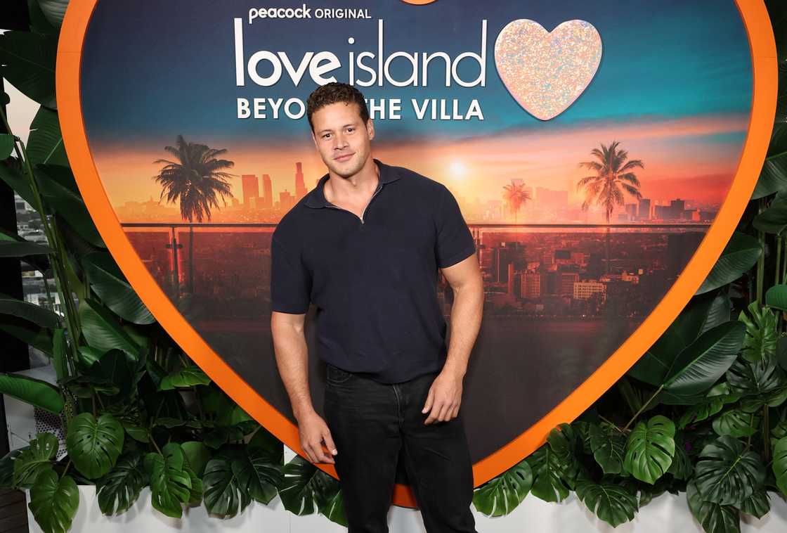 Connor Newsum poses on the red carpet of a Love Island event Connor Newsum poses on the red carpet of a Love Island event