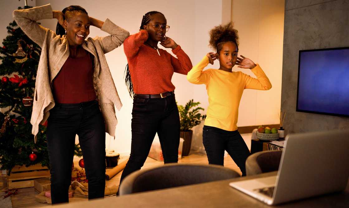 A woman and girls dancing on TikTok