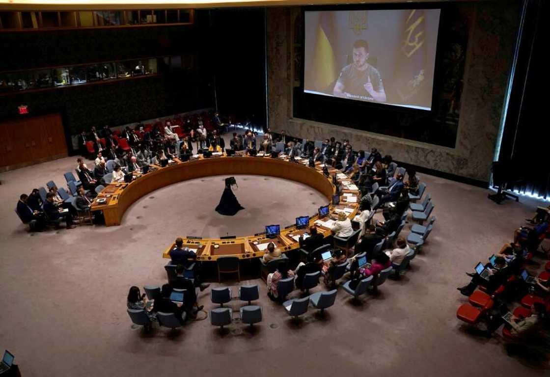Ukrainian President Volodymyr Zelensky appears on screen as he addresses the UN Security Council meeting on Ukraine in New York on August 24, 2022 Ukrainian President Volodymyr Zelensky appears on screen as he addresses the UN Security Council meeting on Ukraine in New York on August 24, 2022