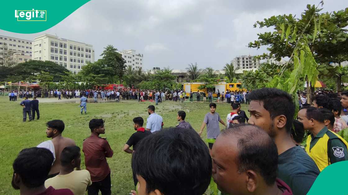 Photos of people watching site of plane crash in Bangladesh. Photos of people watching site of plane crash in Bangladesh.